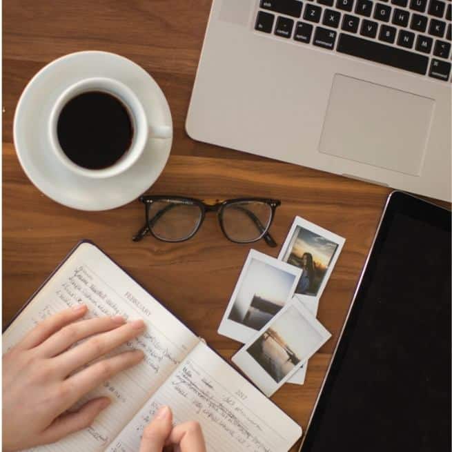mapiful shows a flatlay image of someone working at a desk with a diary, tablet, computer and cup of coffee