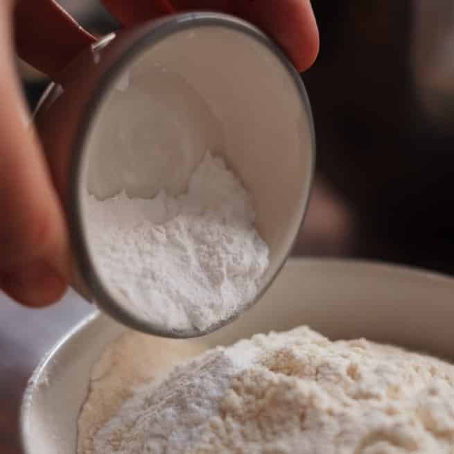 Flour being scooped 