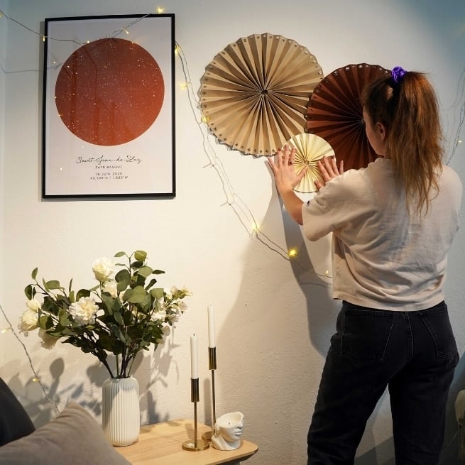 DIY paper pinwheel decorations next to a star map poster of saint jean de luz, pays basque
