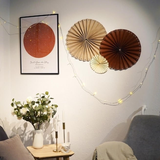 DIY paper pinwheel decorations on a wall
