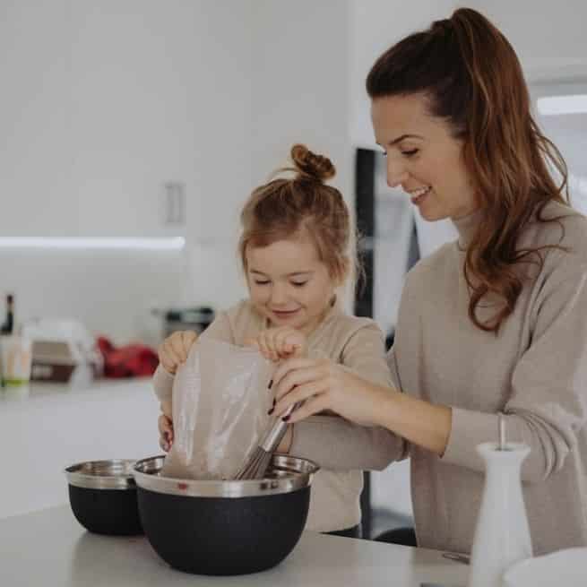 girl and her mother baking