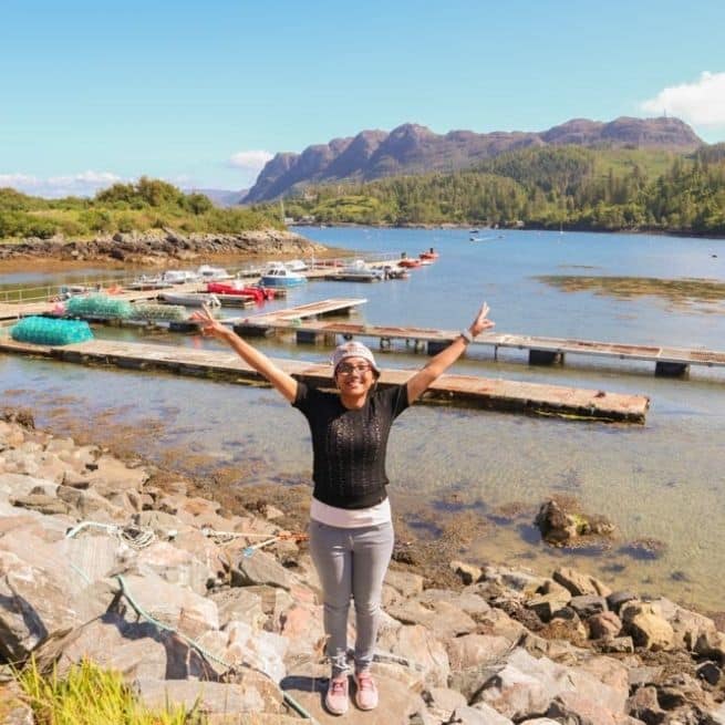 woman in front of lake