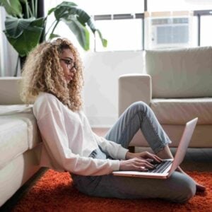 woman taking the interior design style quiz on her laptop at home